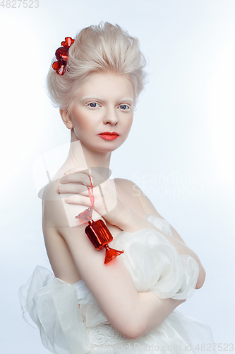 Image of beautiful albino young woman with red lips