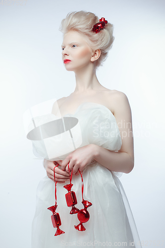 Image of beautiful albino young woman with red lips