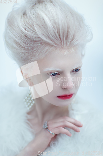 Image of beautiful albino young woman with red lips