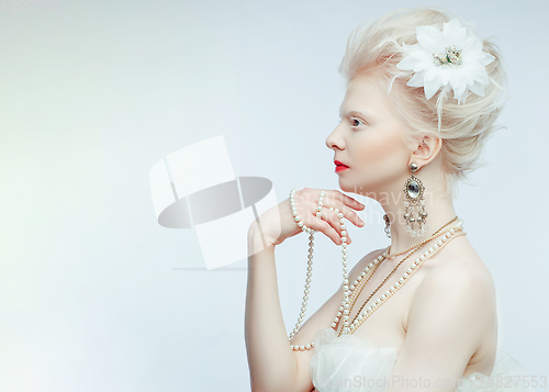 Image of beautiful albino girl with red lips on white background