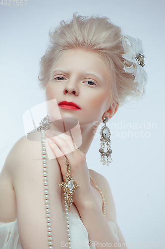 Image of beautiful albino girl with red lips on white background