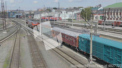 Image of BARNAUL - AUGUST 22: Cargo red train rides on the railway station on August 22, 2017 in Barnaul, Russia