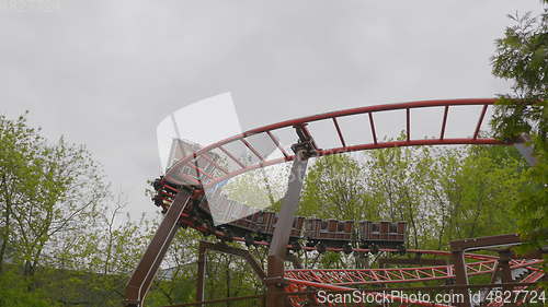 Image of MOSCOW, RUSSIA, May 21, 2017: Children go in roller coaster and having fun on a cloudy day, Moscow.