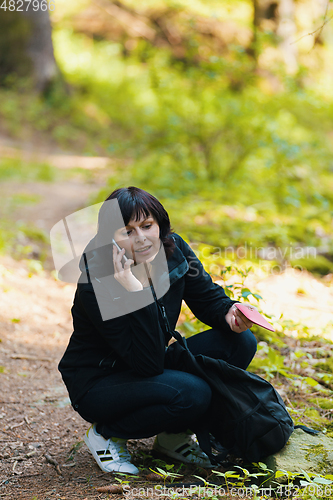 Image of Middle age woman, on hiking trip