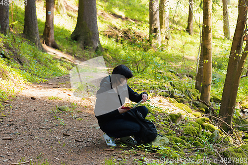 Image of Middle age woman, on hiking trip