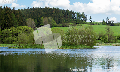 Image of Beautiful spring landscape with small pond.