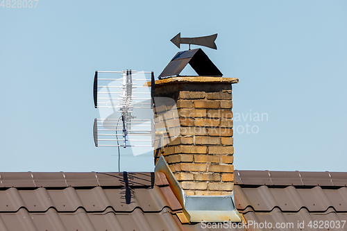 Image of chimney from bricks in the house