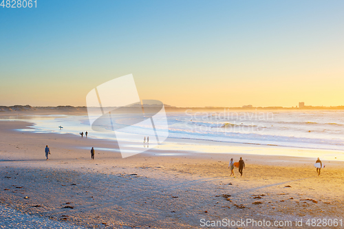 Image of People  surfers walking beach ocean