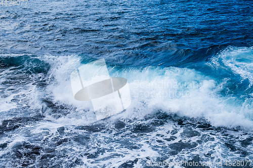 Image of beautiful view on ocean water and black lava sand