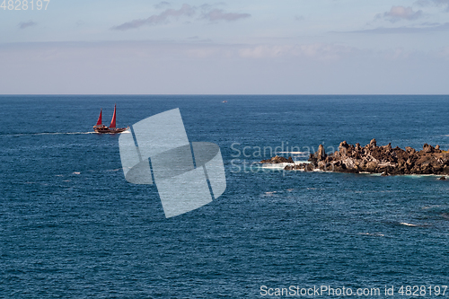 Image of beautiful view on ocean water and black lava sand