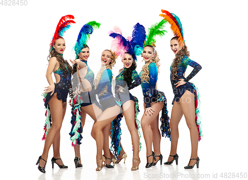 Image of Beautiful young women in carnival and masquerade costumes on white studio background