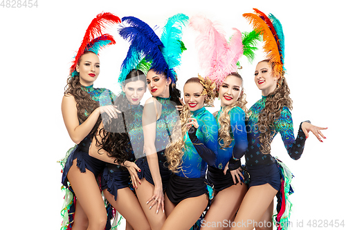 Image of Beautiful young women in carnival and masquerade costumes on white studio background