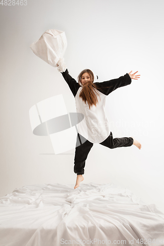 Image of Little girl in soft warm pajama having party colored bright playing at home