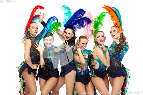 Image of Beautiful young women in carnival and masquerade costumes on white studio background