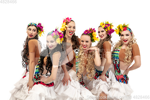 Image of Beautiful young women in carnival and masquerade costumes on white studio background