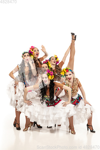 Image of Beautiful young women in carnival and masquerade costumes on white studio background