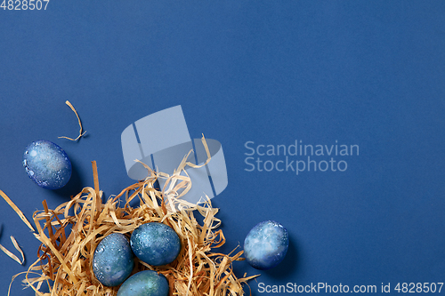 Image of Egg hunt is coming. Easter traditions, space, cosmos colored eggs, top view