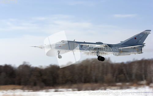 Image of Military jet bomber Su-24 Fencer flying