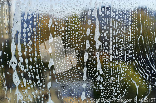 Image of Natural texture with soap foam pattern on glass