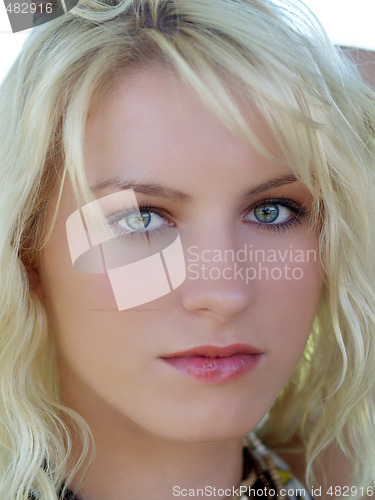 Image of Closeup portrait of young blond teenage girl