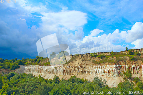 Image of Cretaceous quarry. Landscape with sandy cliffs and beautiful sky