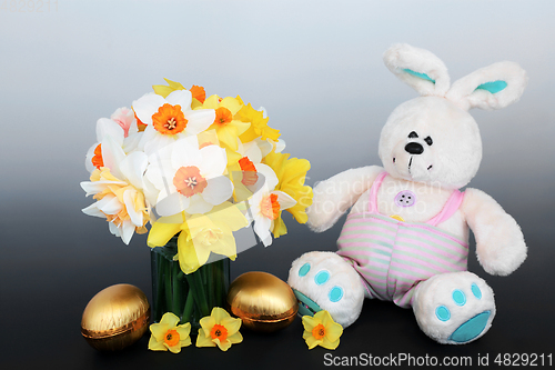 Image of Easter Bunny Golden Eggs and Spring Daffodil Composition 