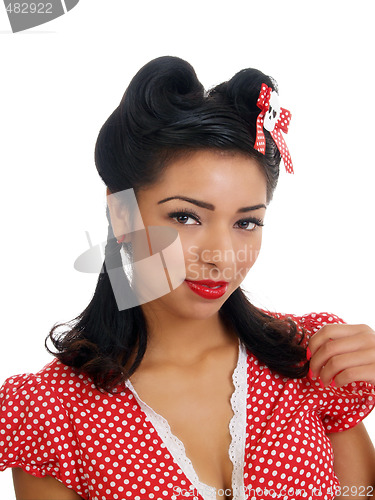 Image of Young hispanic woman in polka dot top