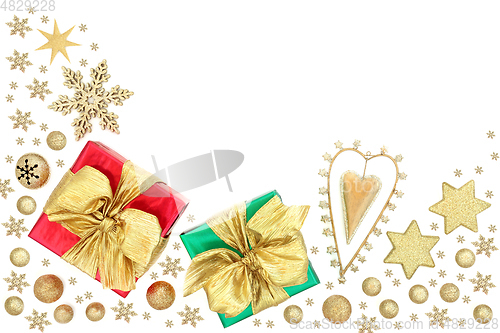 Image of Christmas Gifts with Retro Heart Ornament and Gold Baubles 