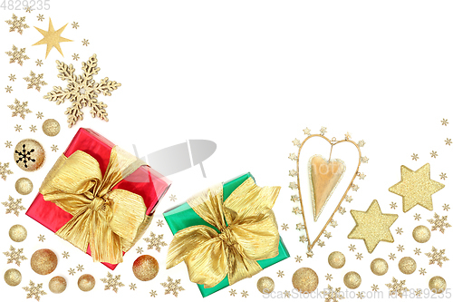 Image of Christmas Gifts with Retro Heart Ornament and Gold Baubles 
