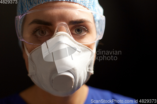 Image of doctor in goggles and protective face mask