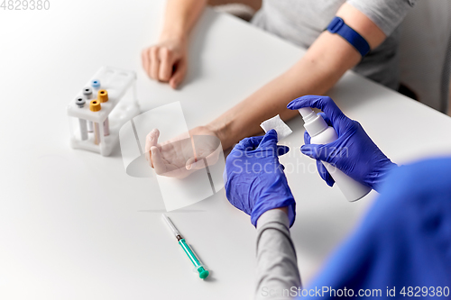 Image of doctor and patient preparing for blood test