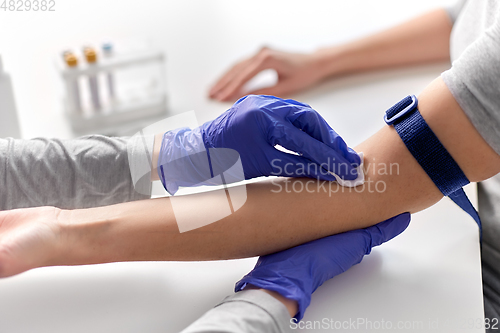 Image of doctor and patient preparing for blood test