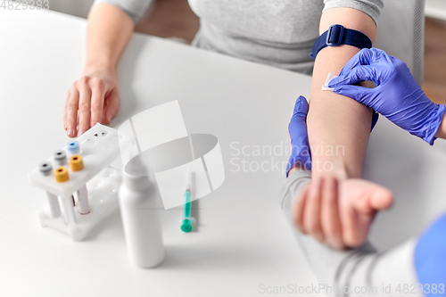 Image of doctor and patient preparing for blood test