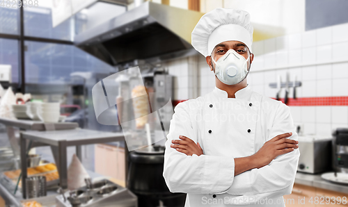 Image of male chef with in respirator at kebab shop kitchen
