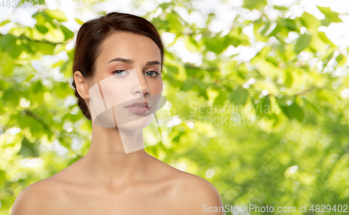 Image of beautiful young woman with bare shoulder