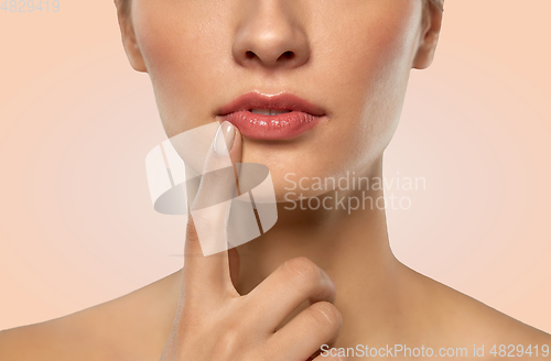 Image of close up of beautiful young woman face and lips