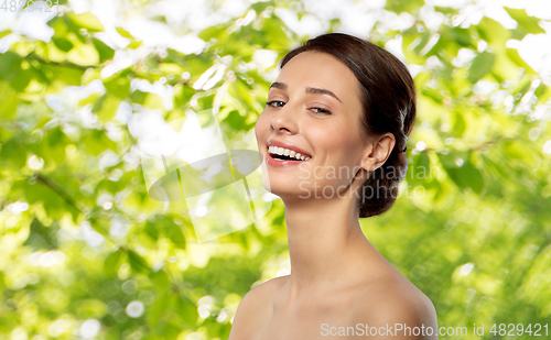 Image of beautiful young woman with bare shoulder