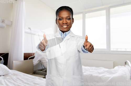 Image of african american female doctor showing thumbs up