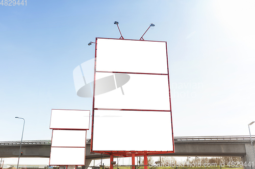 Image of big white billboard template in city
