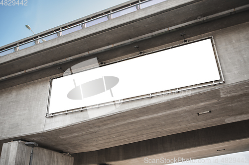 Image of big white billboard template on bridge