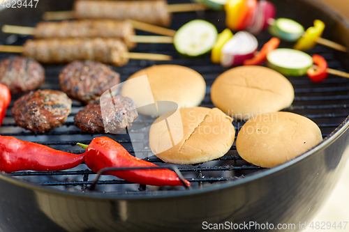 Image of barbecue kebab meat and vegetables on grill