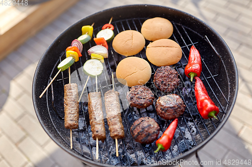 Image of barbecue kebab meat and vegetables on grill