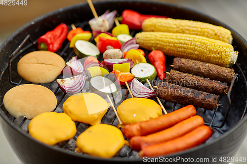 Image of barbecue kebab meat and vegetables on grill