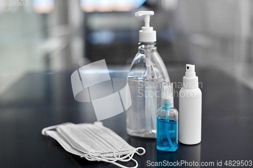 Image of hand sanitizers, medical masks and liquid soap