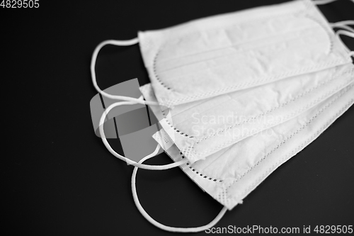 Image of close up of white face protective medical masks