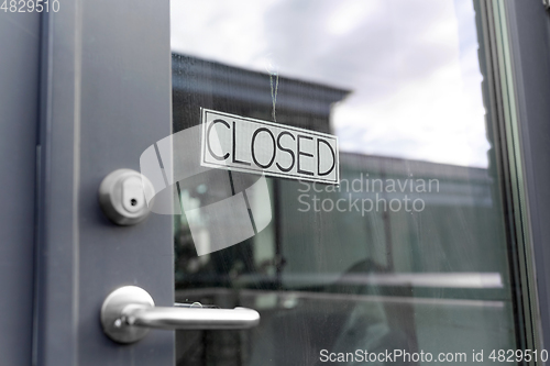 Image of glass door of closed shop or office