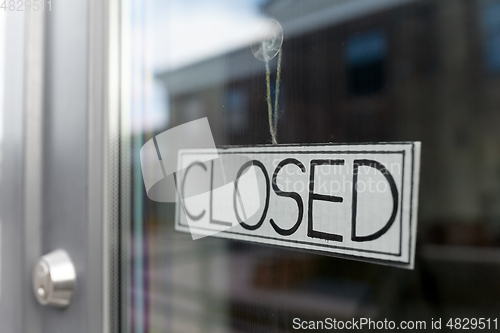 Image of glass door of closed shop or office