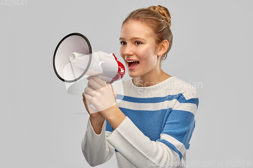 Image of teenage girl speaking to megaphone