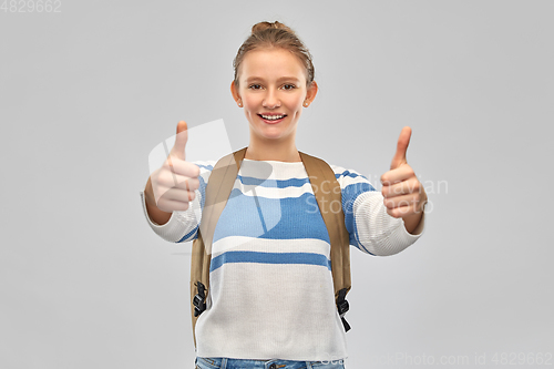 Image of smiling teenage student girl with school bag