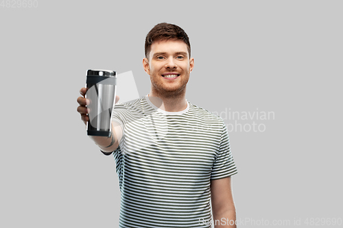 Image of man with thermo cup or tumbler for hot drinks